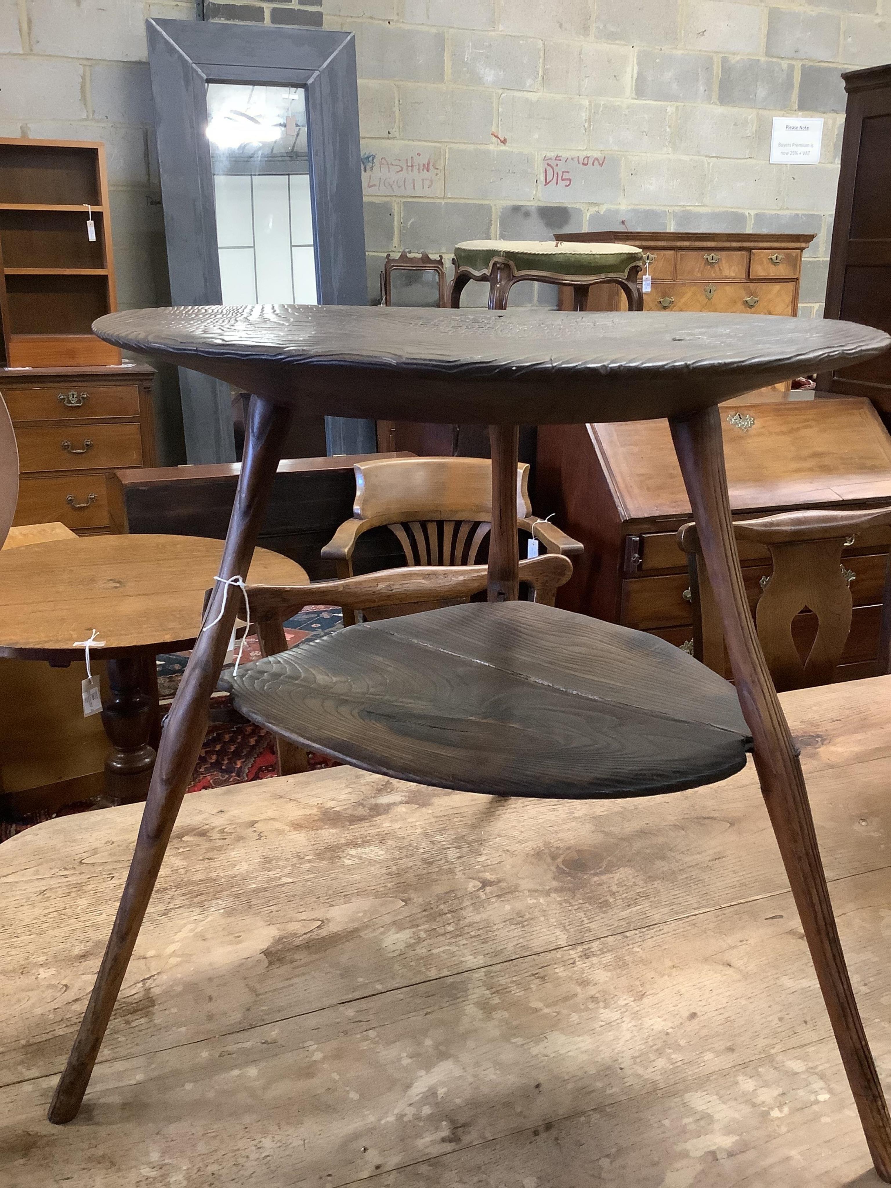 An unusual 18th century weathered elm cricket table, width 61cm, height 60cm. Condition - fair to good